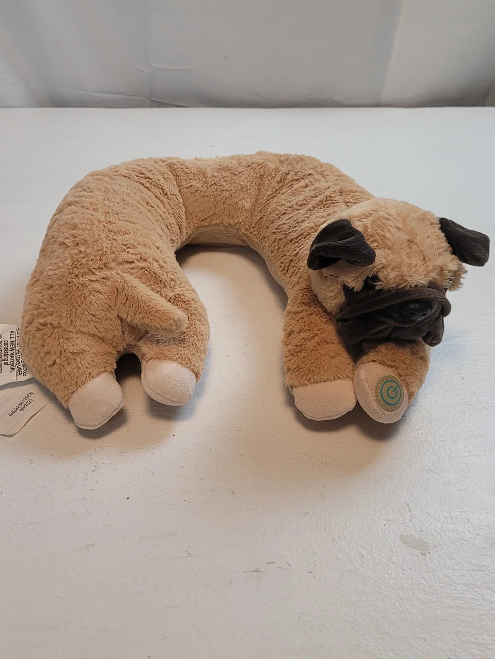 Health Touch Vibrating Neck Massager designed like a plush pug dog pillow